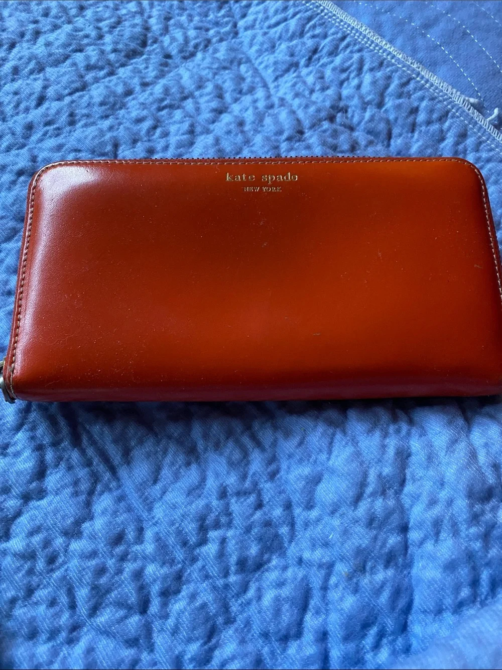 kate spade orange  Leather Zip Around Wallet with Gold Logo with pink inside